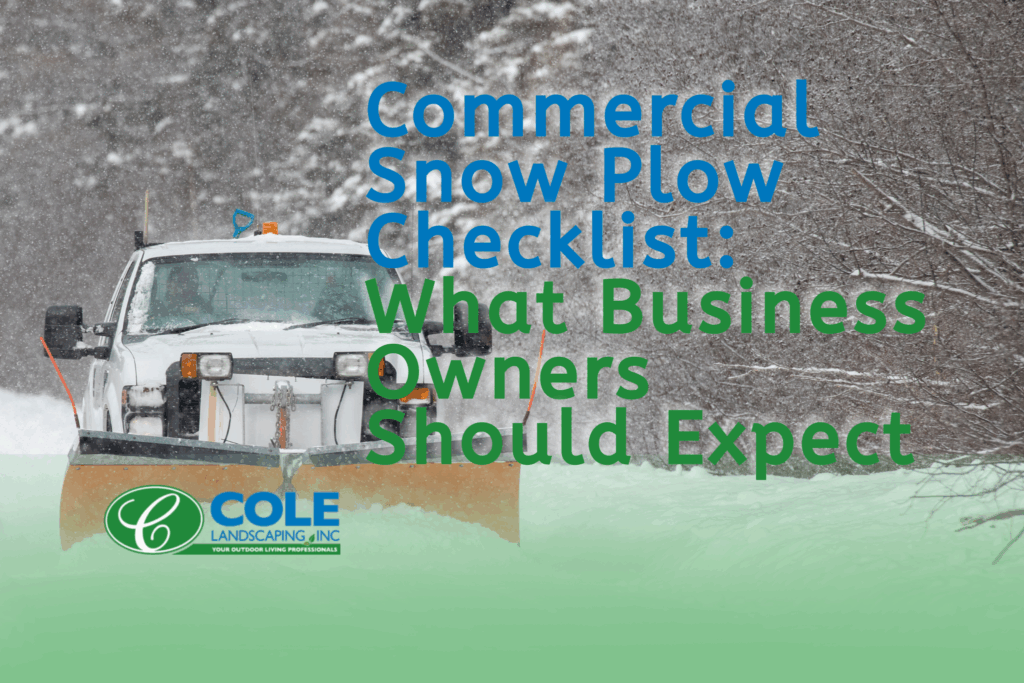 Snow plow clearing a commercial parking lot during a storm